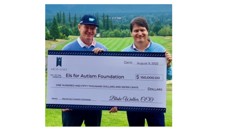 Blake presenting Ernie with Check for Els with Autism 2022